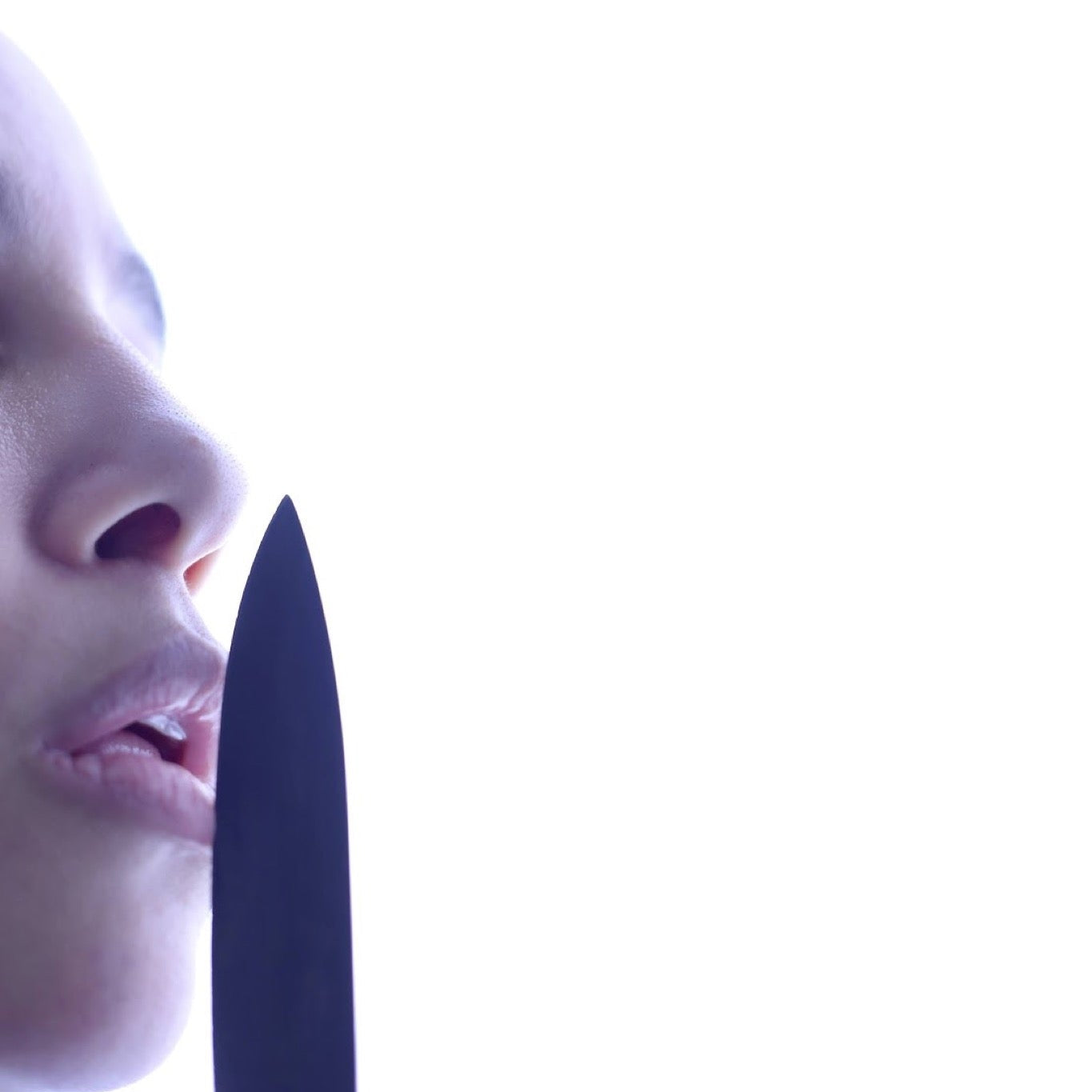 Self portrait for Inktober 2021 prompt risky, a person holding a knife near their lips against a bright white background